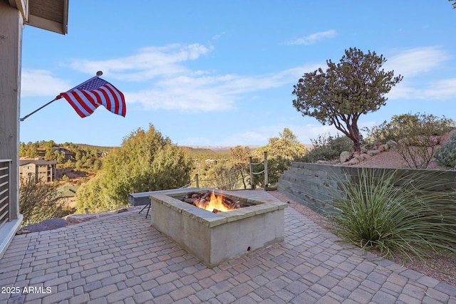 view of patio / terrace with an outdoor fire pit