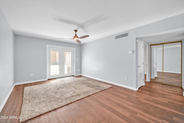 unfurnished room with french doors, hardwood / wood-style flooring, and ceiling fan