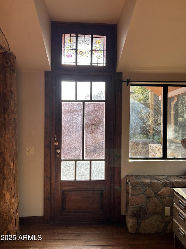 doorway with hardwood / wood-style floors