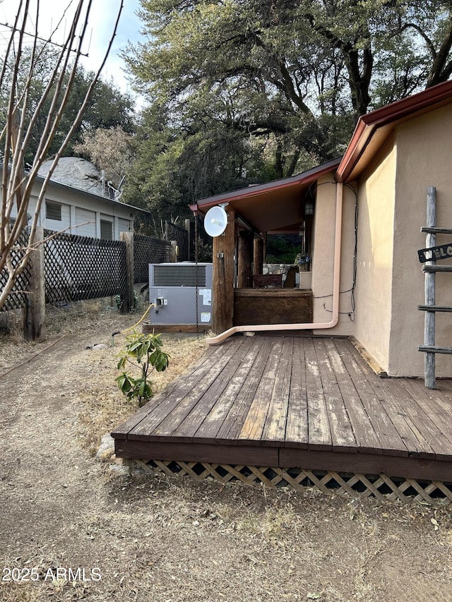 wooden terrace featuring central AC