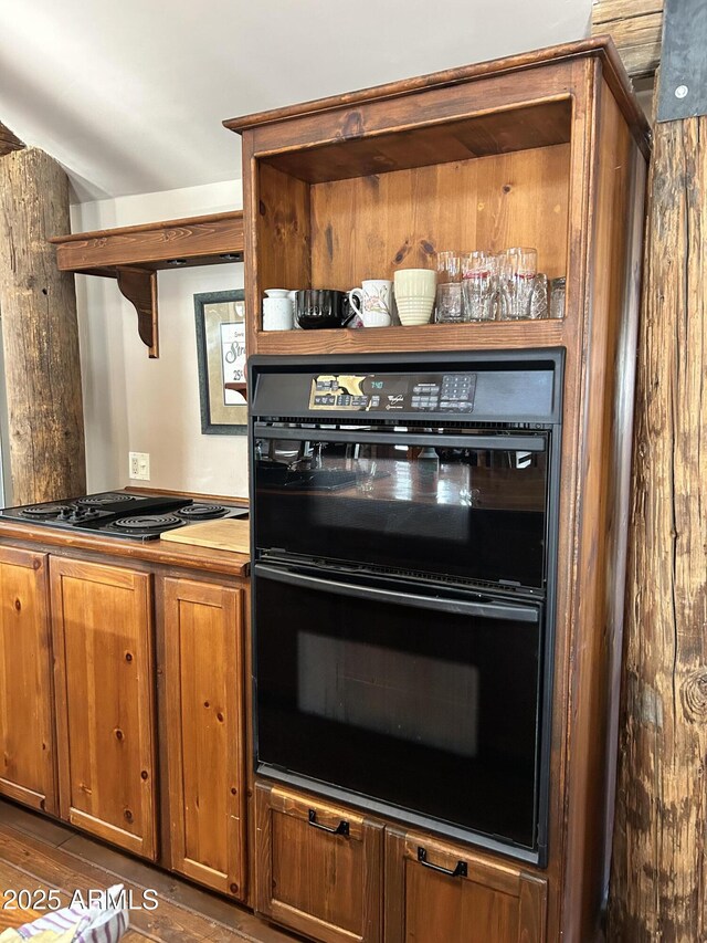 kitchen with black double oven and stovetop