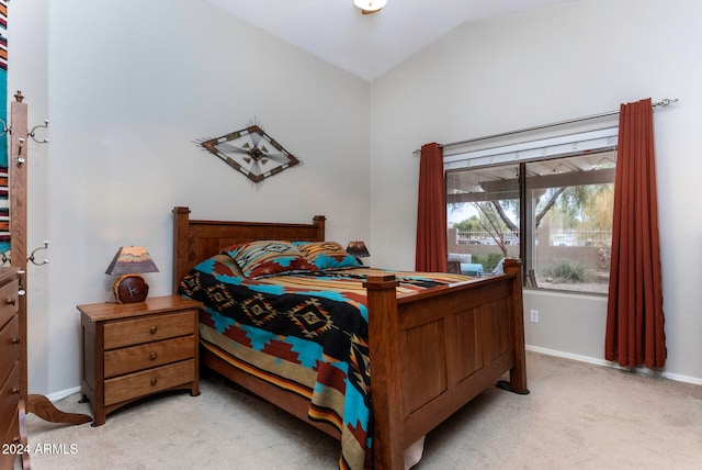 carpeted bedroom featuring vaulted ceiling