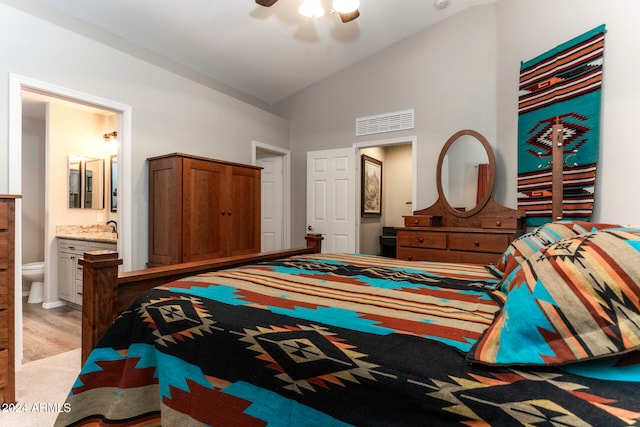 bedroom with ceiling fan, sink, high vaulted ceiling, ensuite bathroom, and light hardwood / wood-style floors