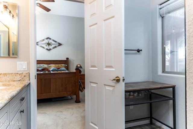 bathroom featuring vanity and ceiling fan