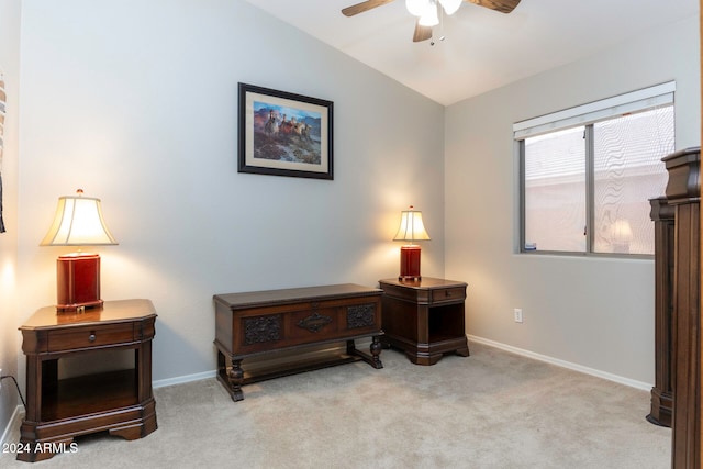 living area featuring light colored carpet, ceiling fan, and lofted ceiling