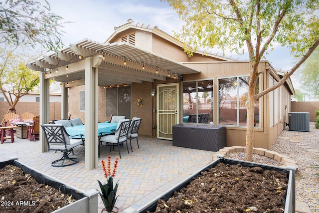 view of patio / terrace featuring outdoor lounge area, a pergola, and central AC