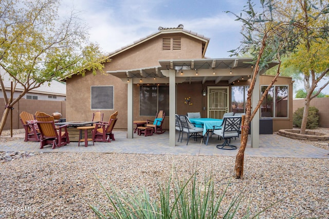 back of house featuring a pergola and a patio area