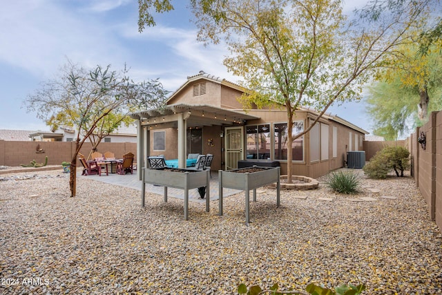 back of property featuring a patio area and central air condition unit