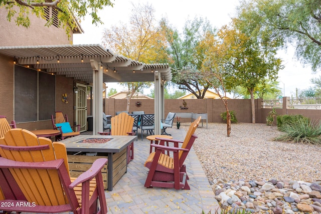 view of patio featuring a pergola and an outdoor fire pit