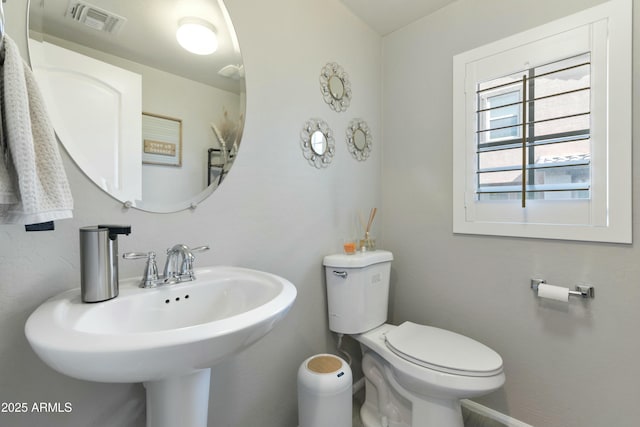 bathroom with sink and toilet