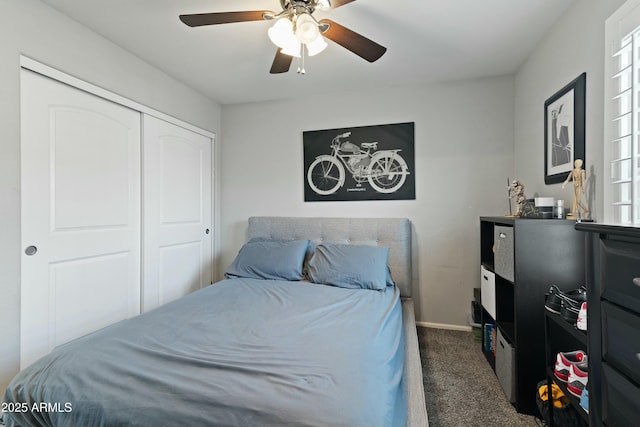 carpeted bedroom with a closet and ceiling fan