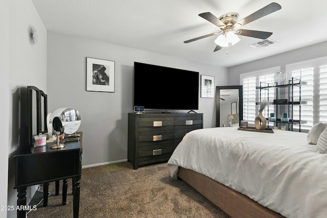 bedroom with ceiling fan and dark carpet