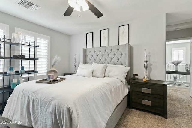 carpeted bedroom with ceiling fan