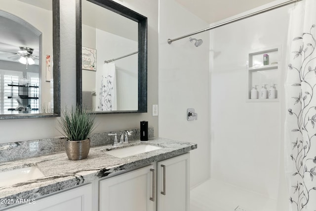 bathroom featuring ceiling fan, vanity, and a shower with shower curtain