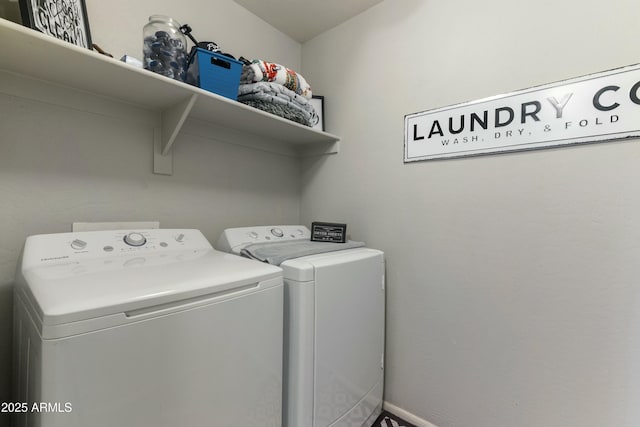 washroom featuring washing machine and clothes dryer