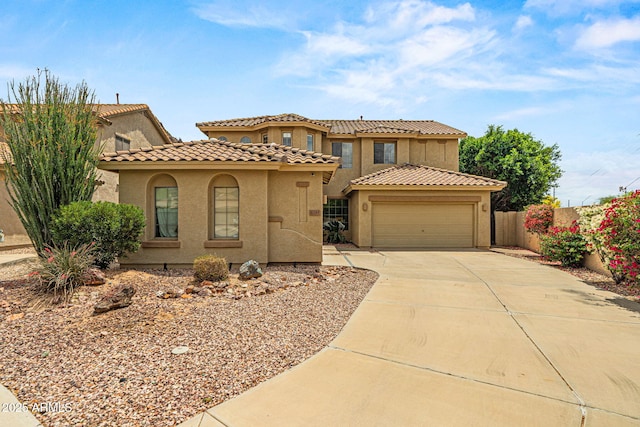6245 W Maya Dr, Phoenix, AZ 85083 - mediterranean / spanish-style home featuring stucco siding, fence, driveway, a tiled roof, and a garage