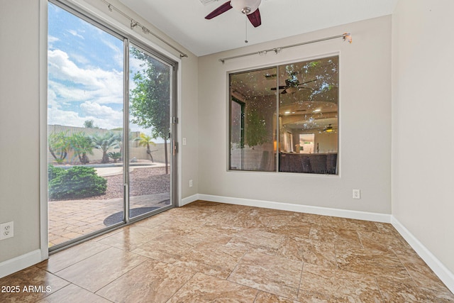 6245 W Maya Dr, Phoenix, AZ 85083 - spare room with ceiling fan, baseboards, and stone finish flooring