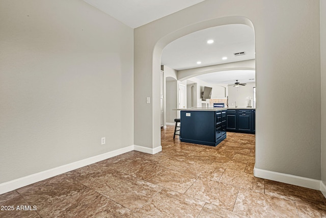 6245 W Maya Dr, Phoenix, AZ 85083 - hallway with arched walkways, baseboards, and recessed lighting