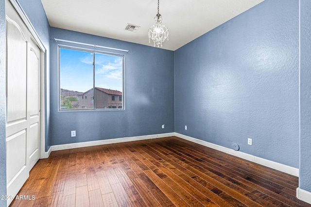 6245 W Maya Dr, Phoenix, AZ 85083 - spare room with dark wood-type flooring, a chandelier, baseboards, and a textured wall