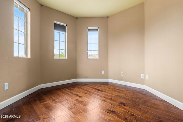 6245 W Maya Dr, Phoenix, AZ 85083 - empty room with dark wood-type flooring and baseboards