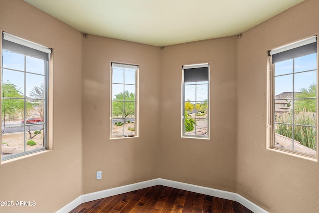6245 W Maya Dr, Phoenix, AZ 85083 - empty room with plenty of natural light, baseboards, and dark wood finished floors