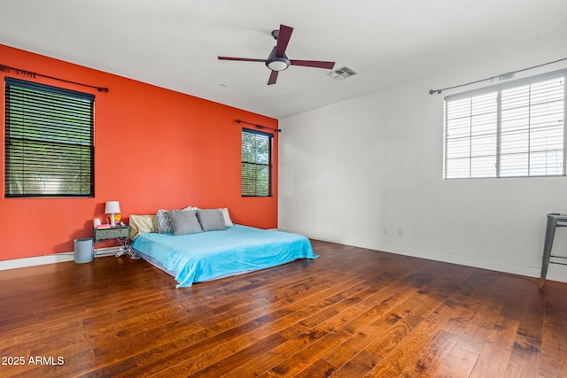 6245 W Maya Dr, Phoenix, AZ 85083 - bedroom featuring wood-type flooring, baseboards, and ceiling fan