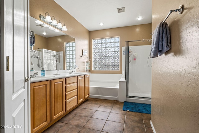 6245 W Maya Dr, Phoenix, AZ 85083 - full bathroom featuring a textured wall, a shower stall, tile patterned floors, a bath, and double vanity