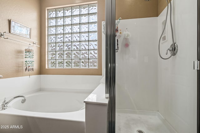 6245 W Maya Dr, Phoenix, AZ 85083 - bathroom with healthy amount of natural light, a shower stall, and a garden tub