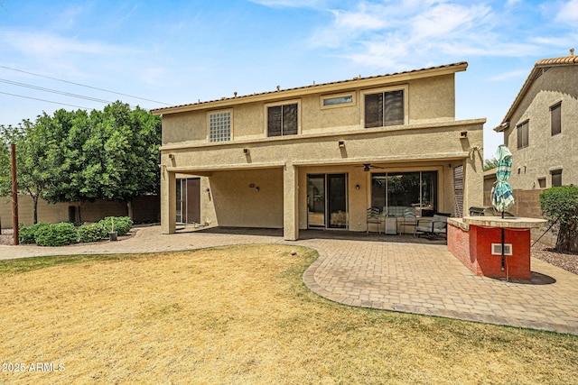 6245 W Maya Dr, Phoenix, AZ 85083 - back of property featuring stucco siding, a patio area, a ceiling fan, and fence