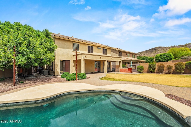 6245 W Maya Dr, Phoenix, AZ 85083 - rear view of house with a patio area, stucco siding, a mountain view, cooling unit, and a tile roof