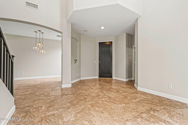 6245 W Maya Dr, Phoenix, AZ 85083 - foyer featuring stairway, arched walkways, baseboards, and a chandelier