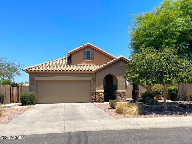 6557 S Classic Way, Gilbert, AZ 85298 - mediterranean / spanish house with stucco siding, a garage, a tile roof, driveway, and stone siding