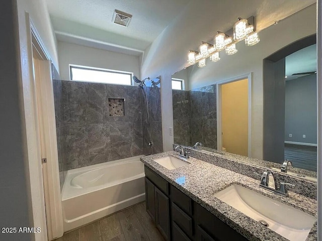 6557 S Classic Way, Gilbert, AZ 85298 - bathroom with wood finished floors, bathtub / shower combination, and double vanity