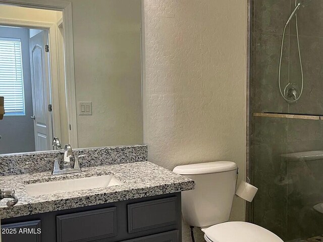 6557 S Classic Way, Gilbert, AZ 85298 - full bath with a textured wall, toilet, a stall shower, and vanity