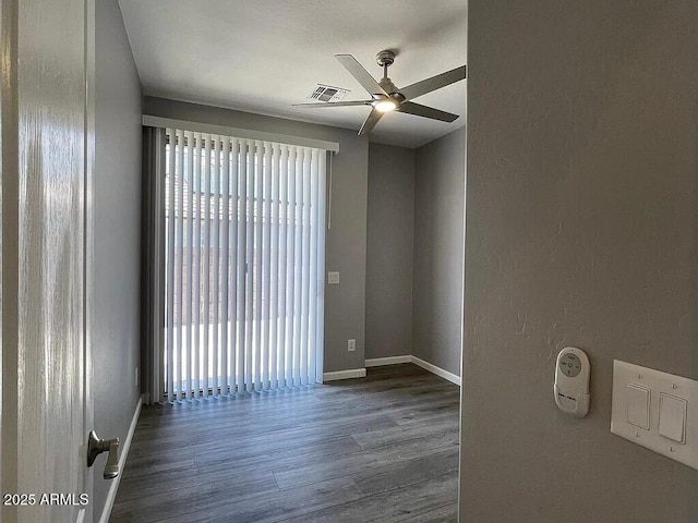 6557 S Classic Way, Gilbert, AZ 85298 - empty room with ceiling fan, wood finished floors, and baseboards
