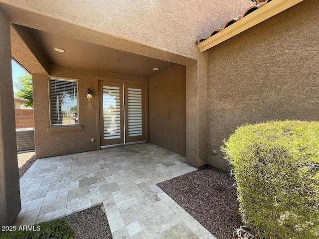 6557 S Classic Way, Gilbert, AZ 85298 - property entrance with stucco siding and a patio area