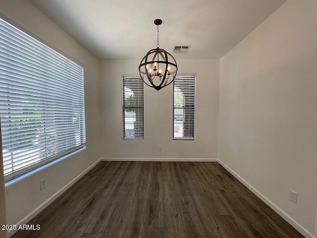 6557 S Classic Way, Gilbert, AZ 85298 - unfurnished room with a chandelier, dark wood finished floors, healthy amount of natural light, and baseboards