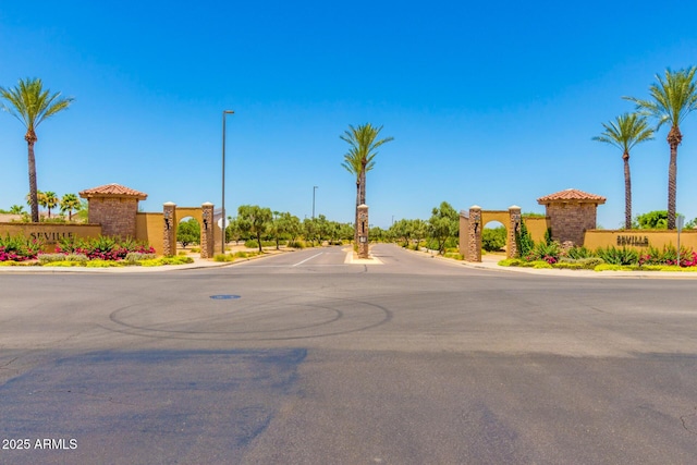 6557 S Classic Way, Gilbert, AZ 85298 - view of asphalt road featuring curbs and street lighting