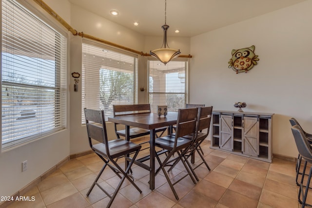 tiled dining room with plenty of natural light