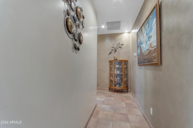 hallway with light tile patterned floors