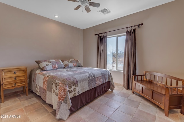 bedroom with ceiling fan and light tile patterned floors