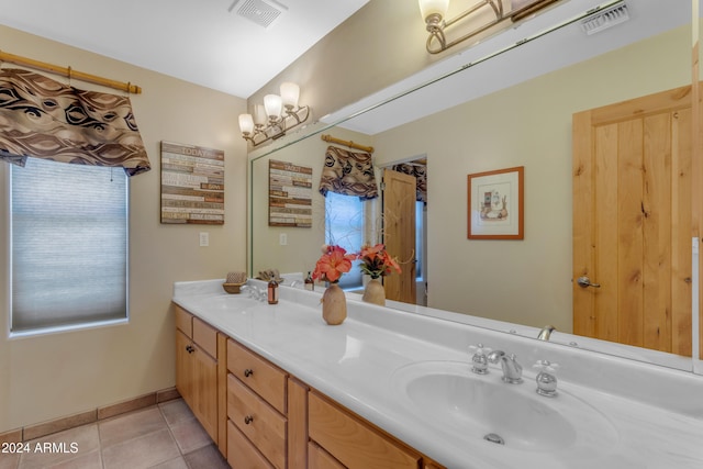 bathroom with tile patterned flooring and vanity