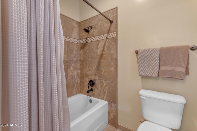 bathroom featuring shower / tub combo with curtain and toilet