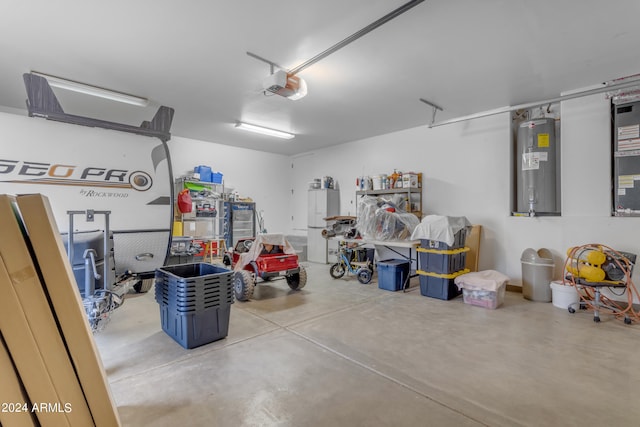 garage featuring a garage door opener and electric water heater