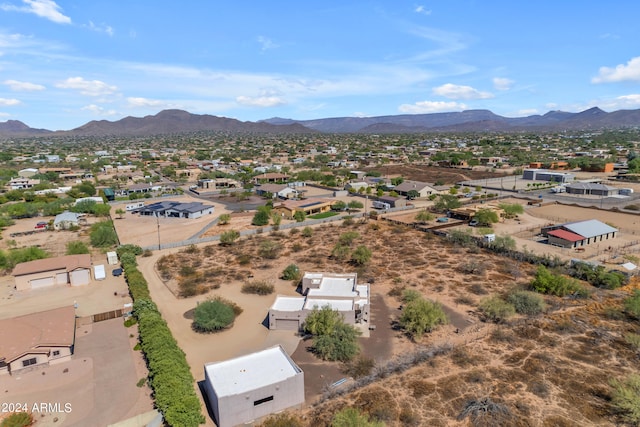 birds eye view of property featuring a mountain view