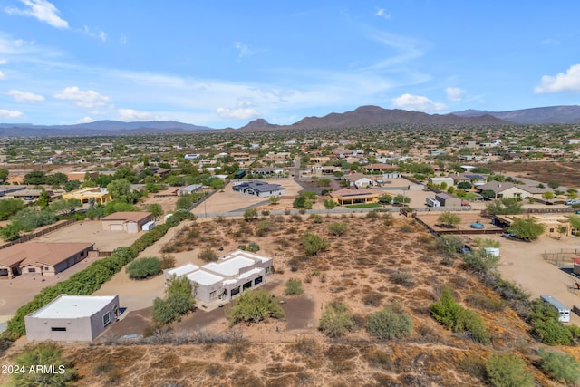 birds eye view of property featuring a mountain view