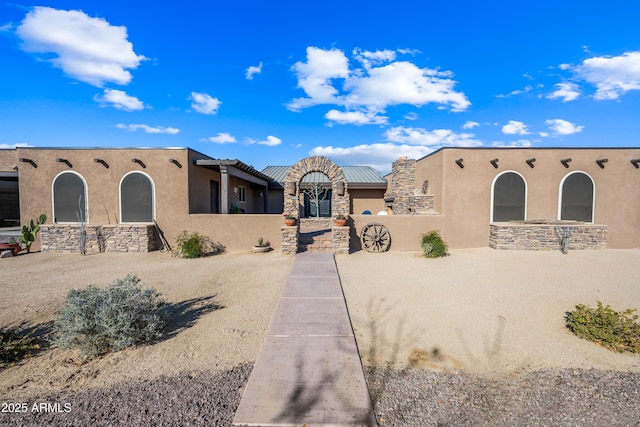 view of pueblo revival-style home