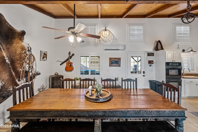 dining area featuring beam ceiling, an AC wall unit, plenty of natural light, and wood ceiling