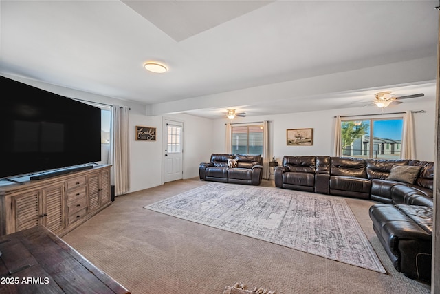 living room with light carpet and ceiling fan