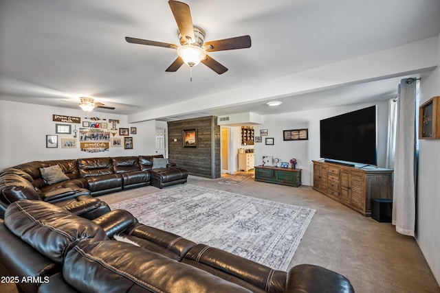 carpeted living room with ceiling fan